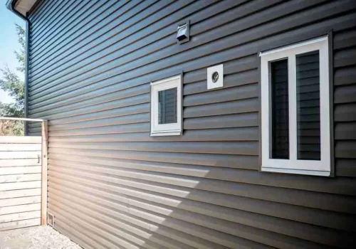 Vinyl siding installation on a residential home exterior Vinyl siding installation on a residential home exterior
